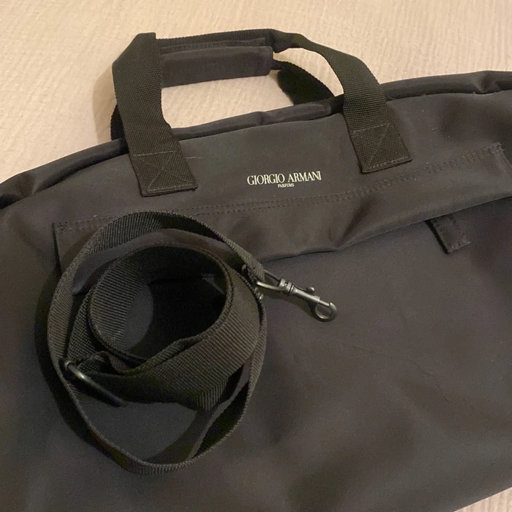 Giorgio Armani Perfums Classic Black Duffel Bag. Unisex model